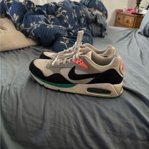 Nike Air Max Sneakers in Black, White, and Teal correlate